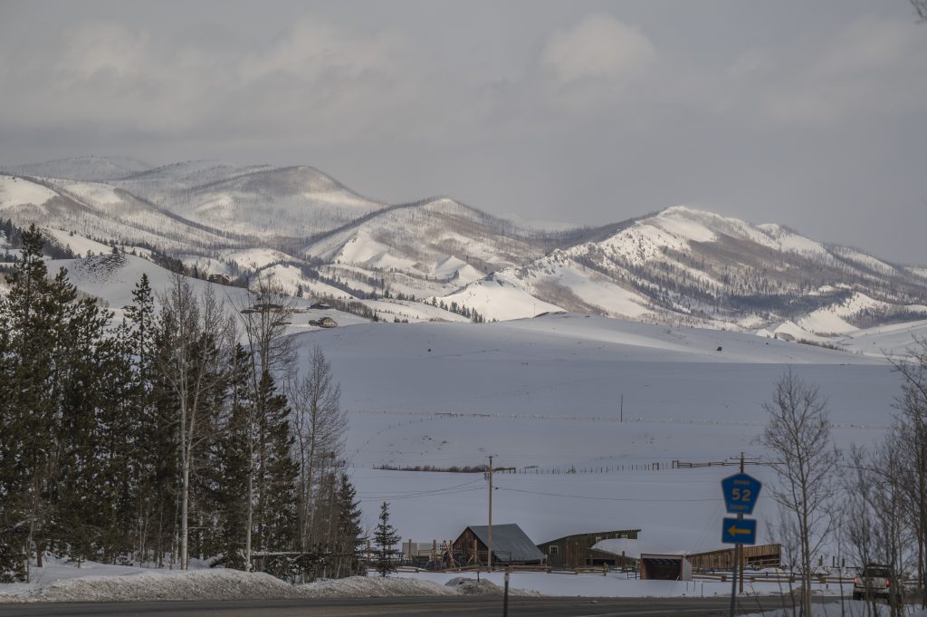 Snow-covered mountains and cabins at YMCA of the Rockies in Grand County.