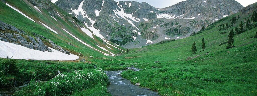 A stream runs through a mountain valley.