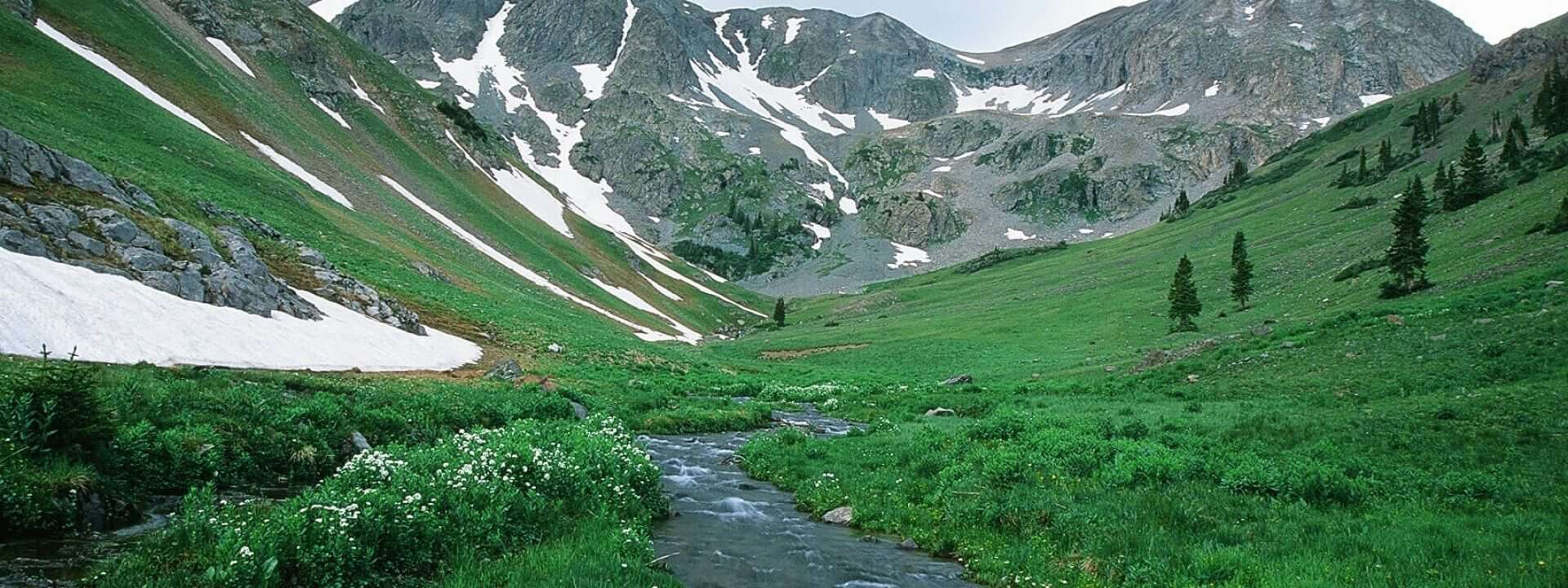 A stream runs through a mountain valley.
