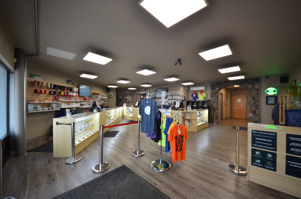 A spacious retail store with clothing racks, display cases, and a variety of merchandise in Grand County Colorado.