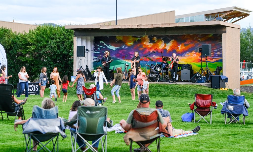 Live music stage and food vendors at the Granby Music & Market in Polhamus Park, Grand County, Colorado.
