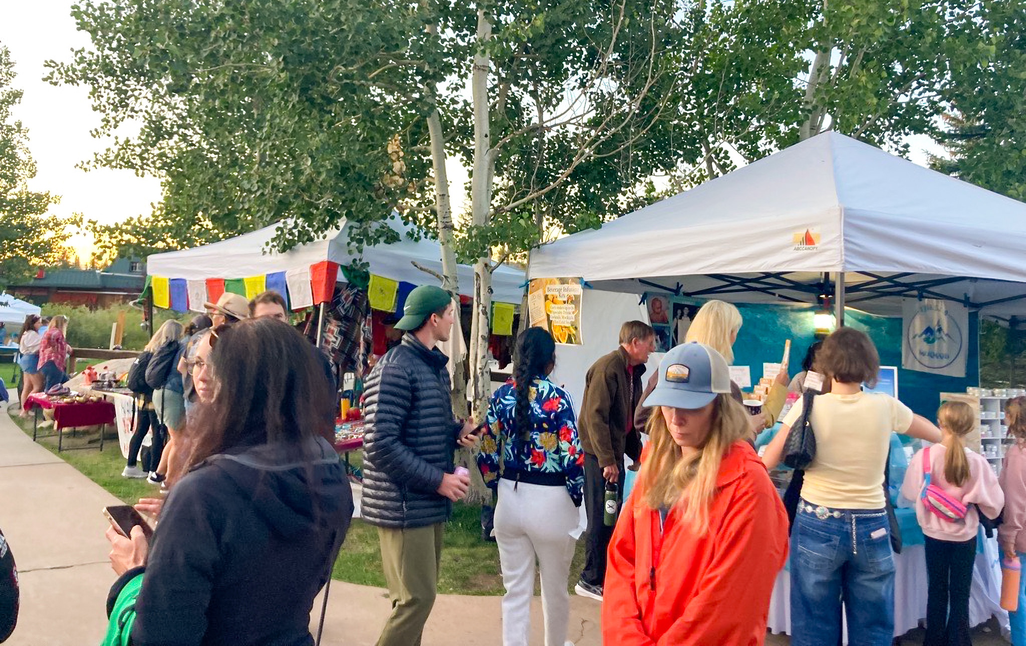 Local vendor booth selling handcrafted goods and fresh produce at the Kremmling Music and Market in the Square.
