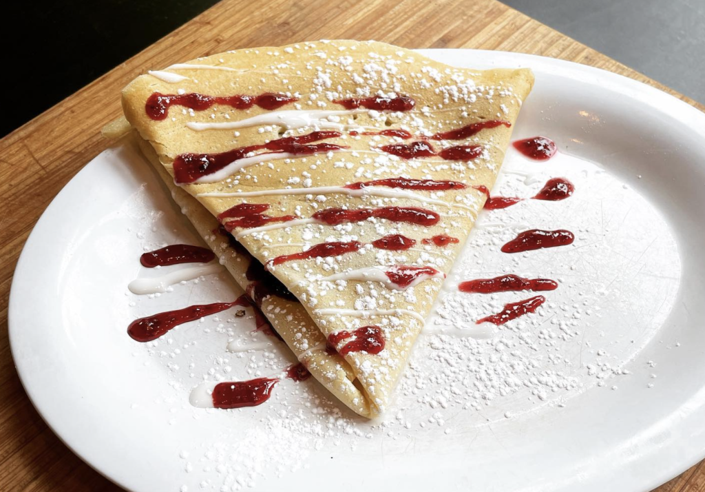 A crepe from Fontenot’s Seafood & Grill on a white plate.